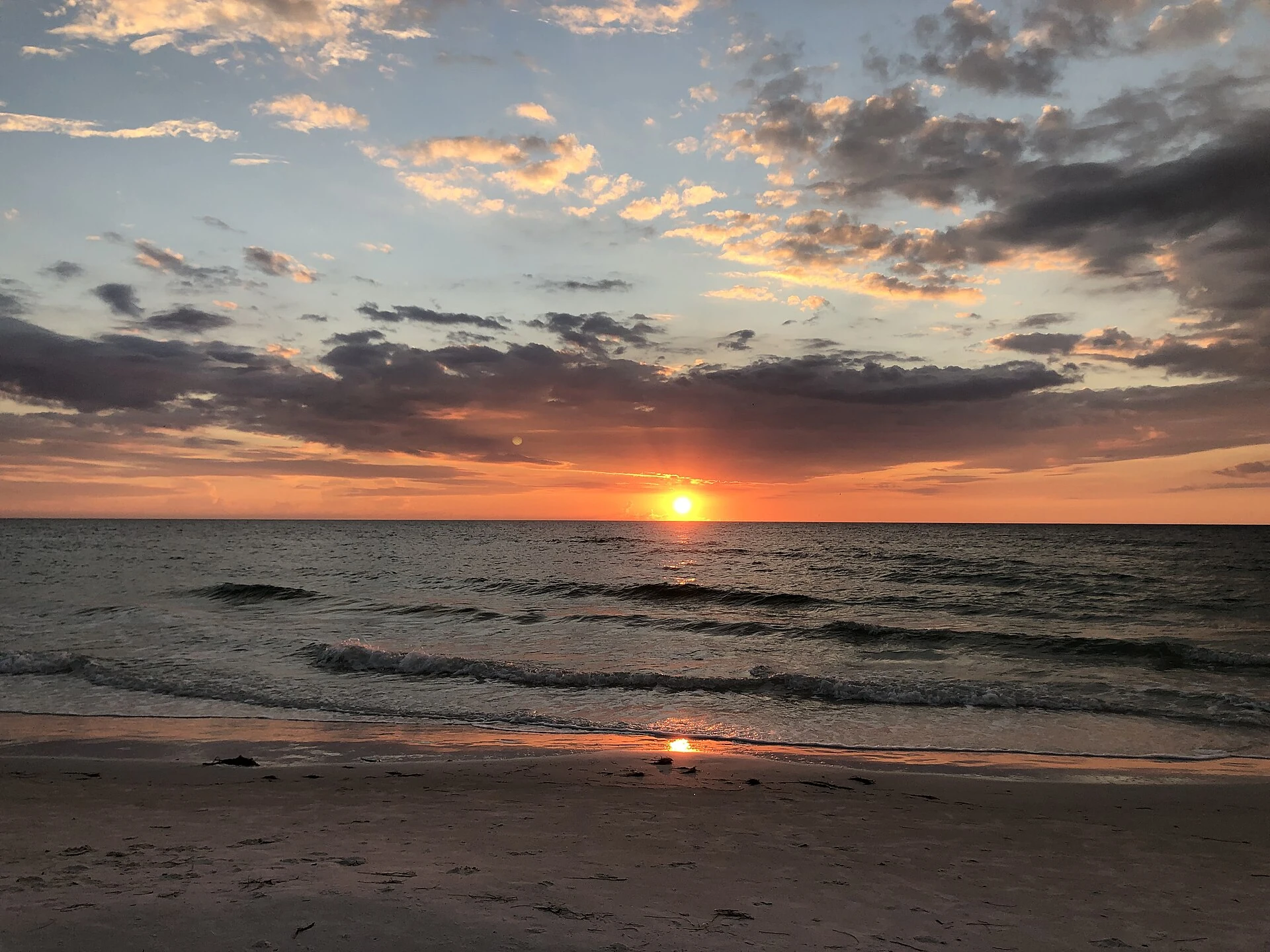 The sun near the horizon over the water at Clearwater Beach